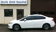 White 2013 Honda Civic Touring with dark automotive window film
